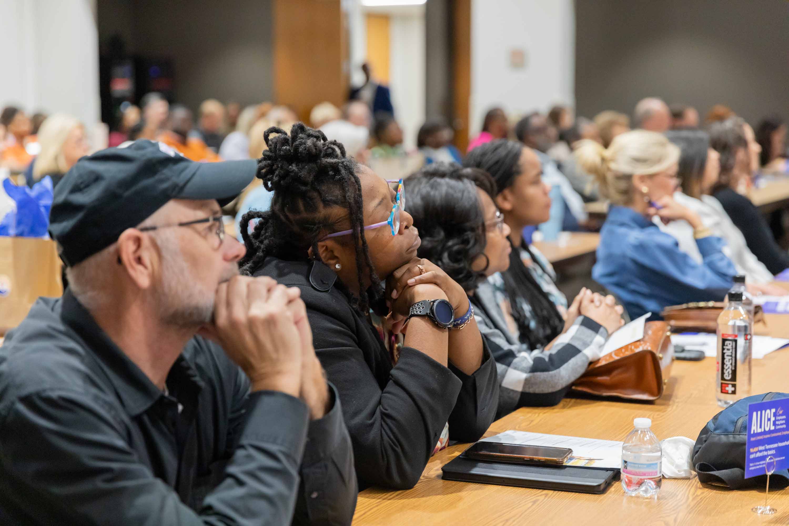 Attendees are listening at the Summit.