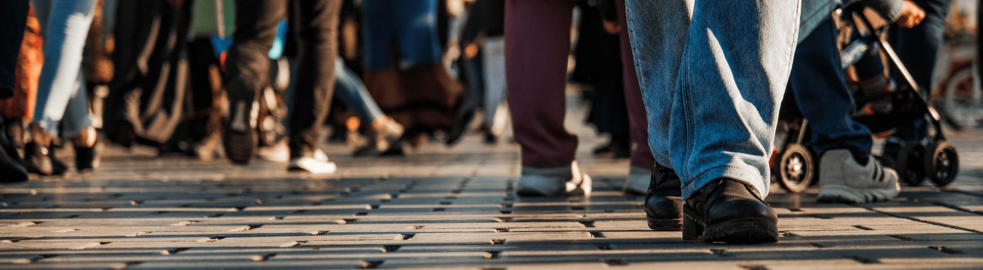 A crowd of people are walking.